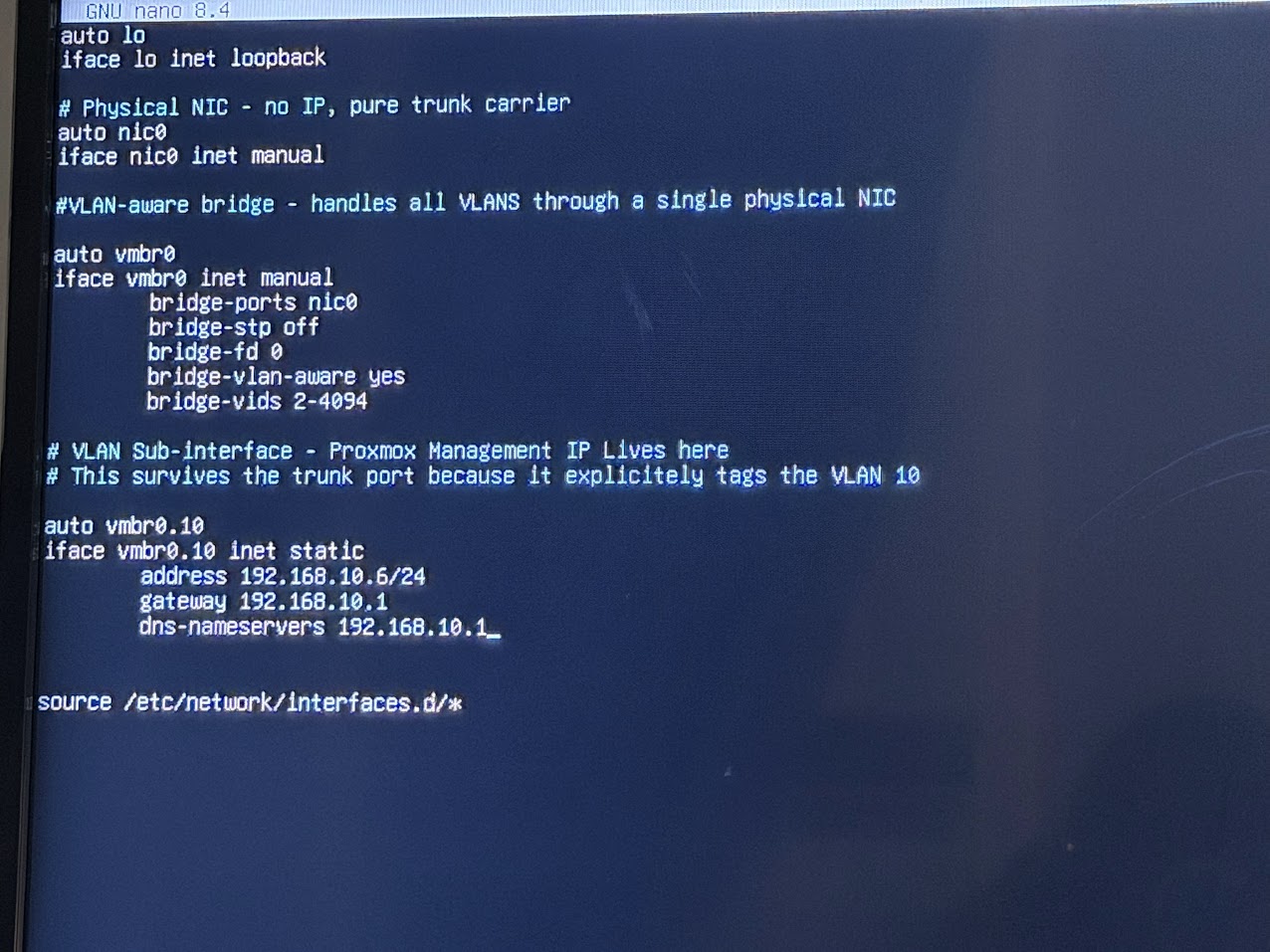 The new /etc/network/interfaces config open in nano showing the VLAN-aware bridge configuration